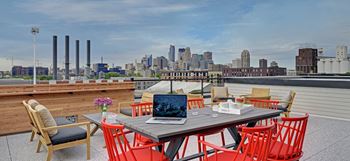 Rooftop with skyline views of minneapolis and grill/firepit